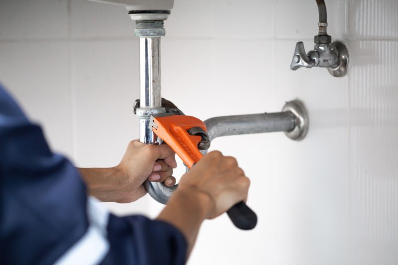 Plumber Repairing Pipe